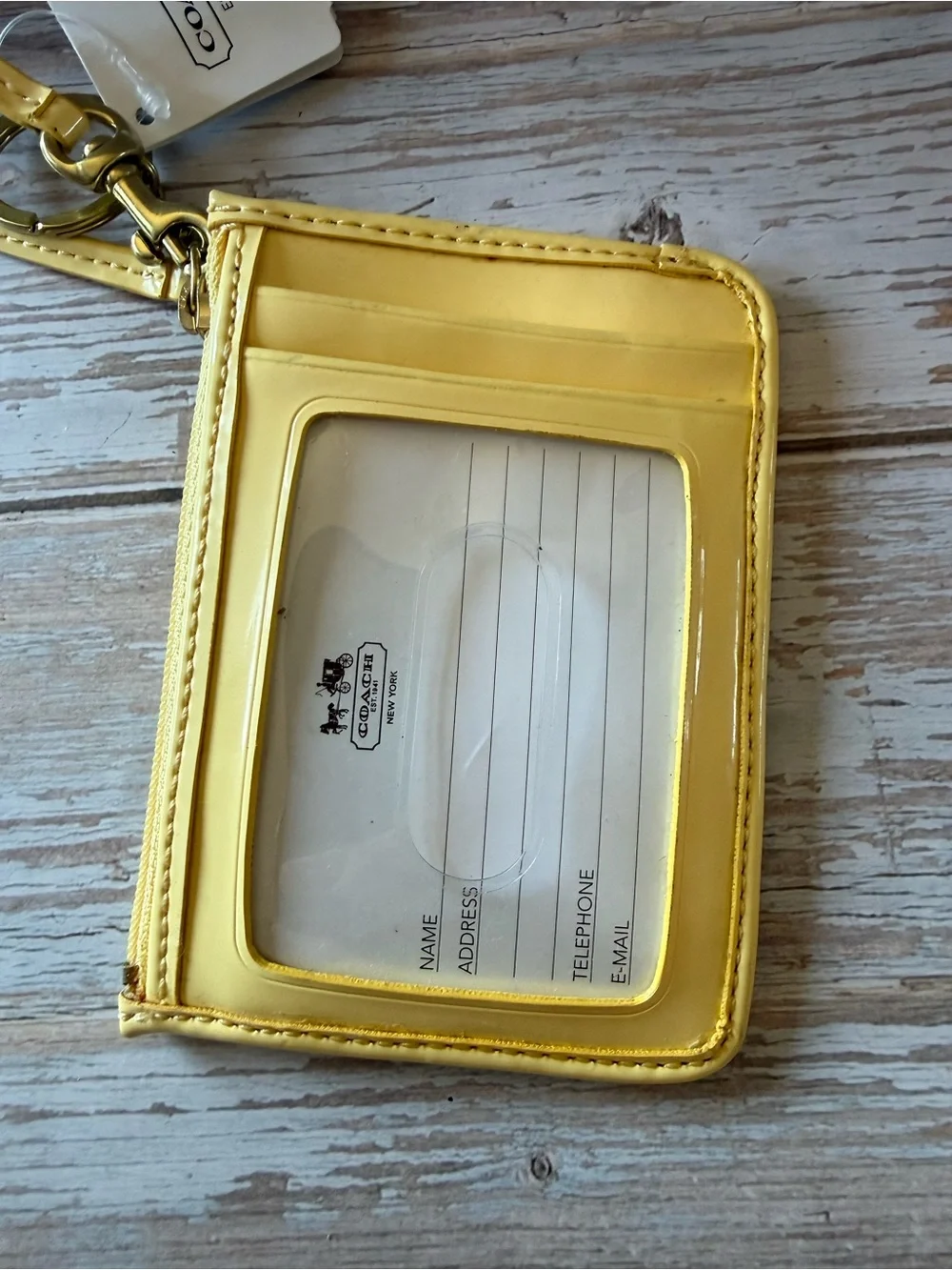 Coach wristlet Buttercup Yellow Signature Embossed Wristlet NWT